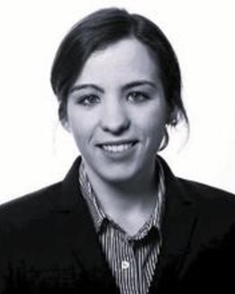 headshot of dark haired woman